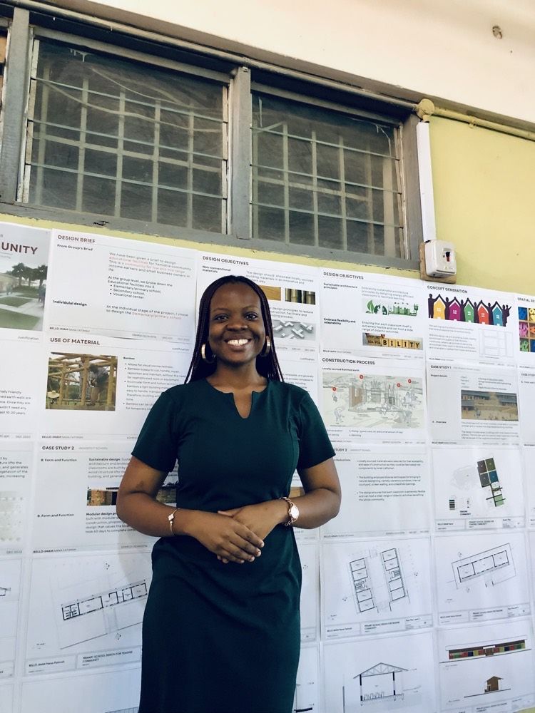 Nana-Fatimah smiling in front of her M.Sc. architecture presentation boards